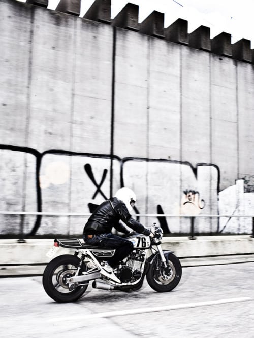 man_riding_vintage_motorcycle
