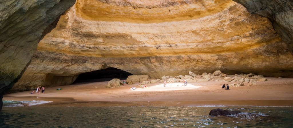 People sunbathing in Benagil Sea Cave photographed from the entrance